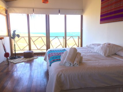 King size bed, ocean view and private balcony. The perfect bedroom for couples.