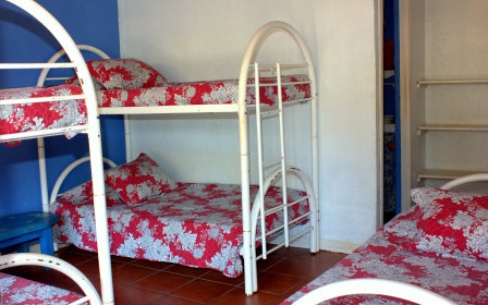 2 bunk beds and one single bed
